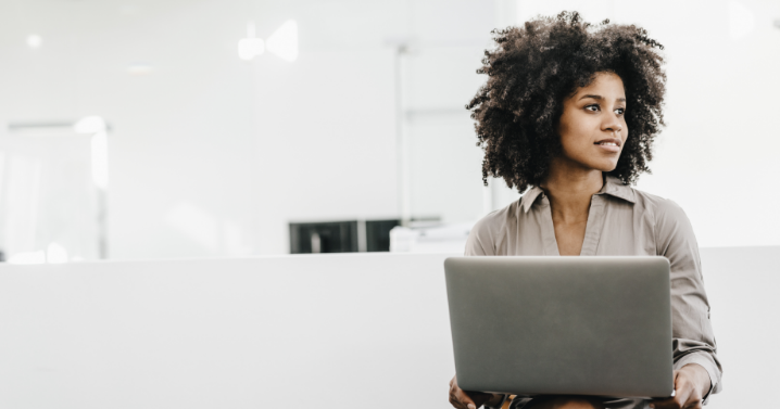 A woman is using her laptop.