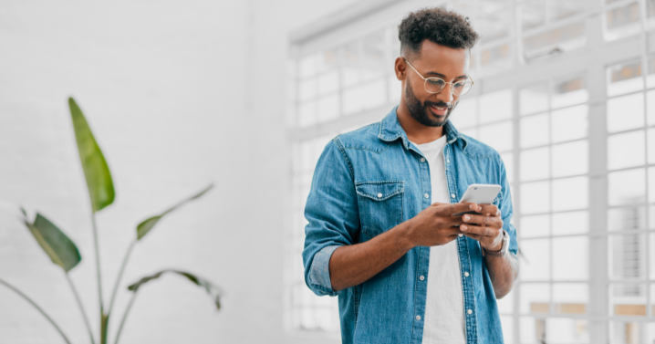 A man is using his phone.