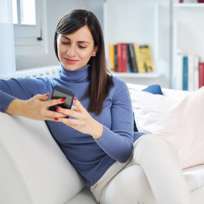 A woman is using her phone.