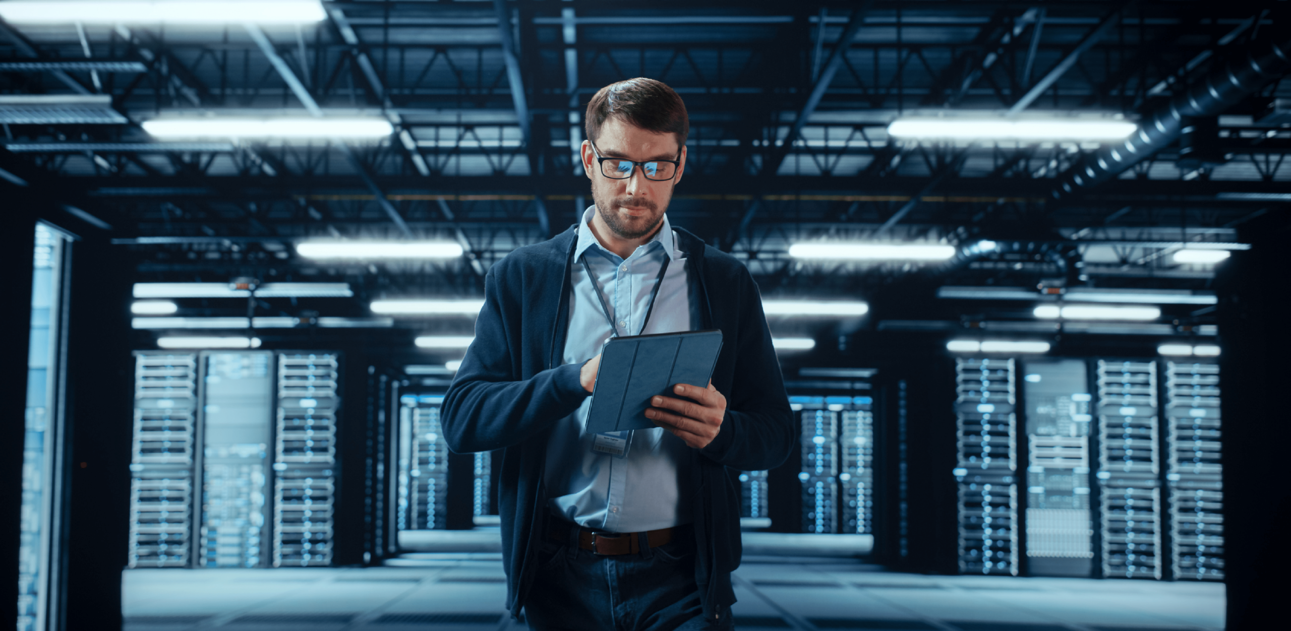 A man is looking down at his phone.