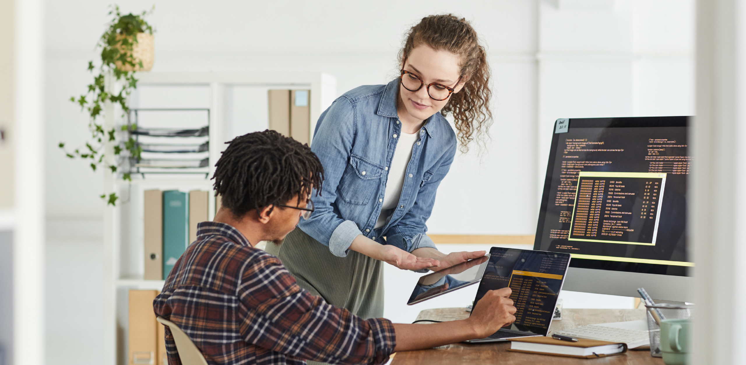 A woman is looking at a man who is speaking to her.